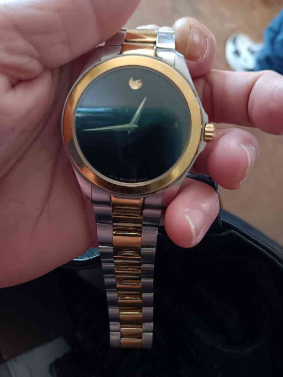 Mens18k gold Movado watch