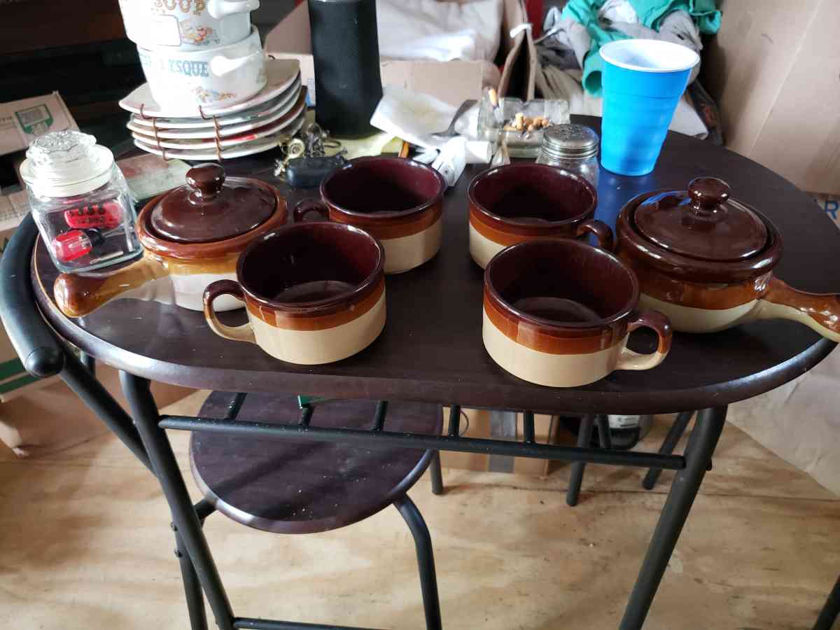 a set of soup bowls with two little matching pots