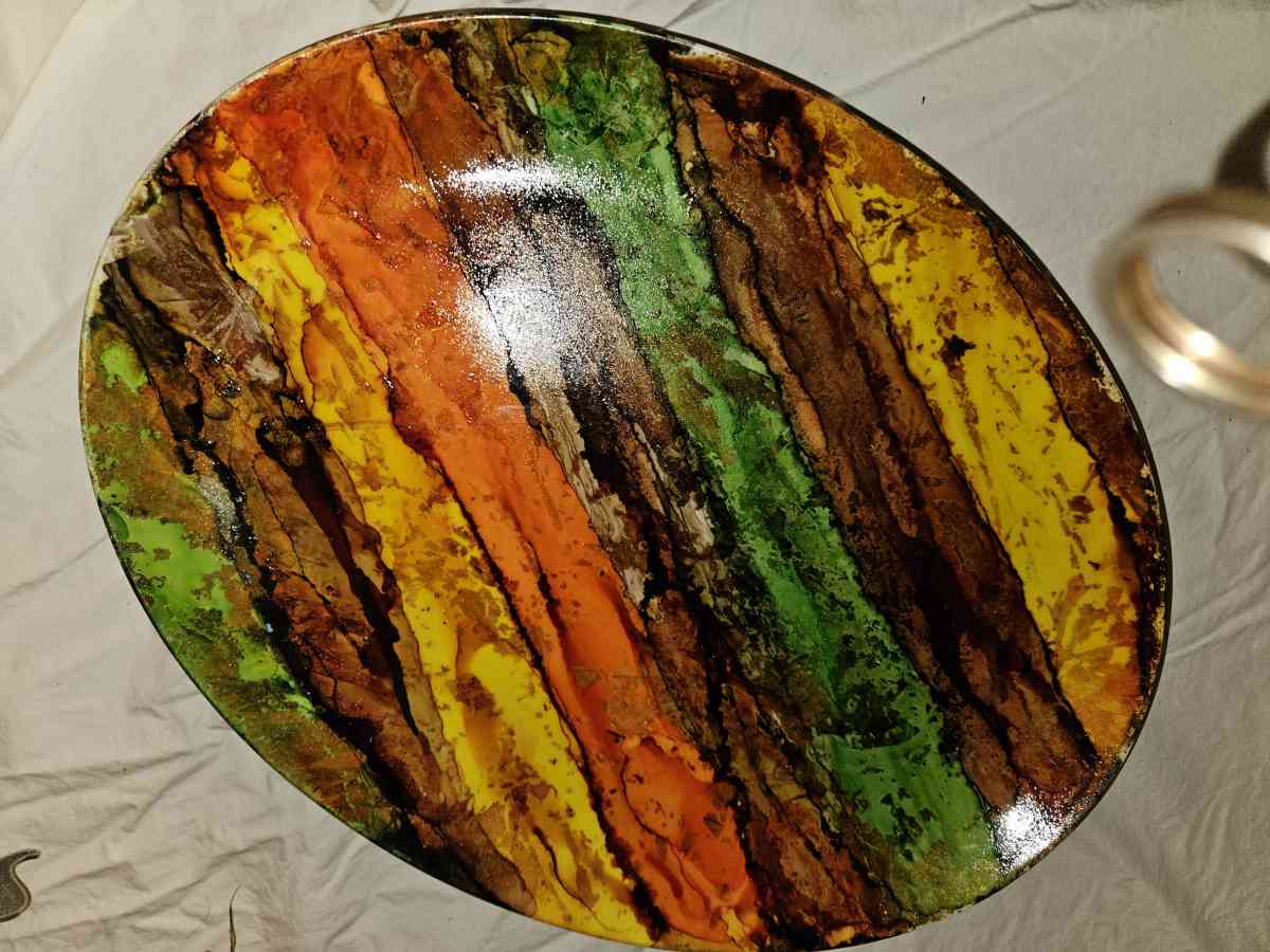 handpainted glass items and wood and stone sculptures