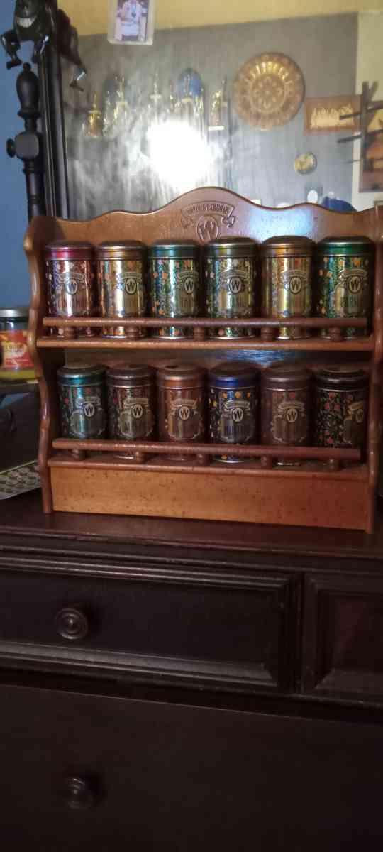 vintage spice cabinet with metal spice tins