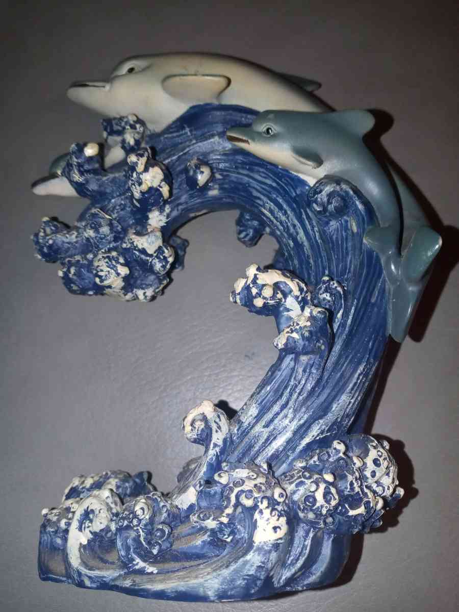 two dolphins in the ocean figurine