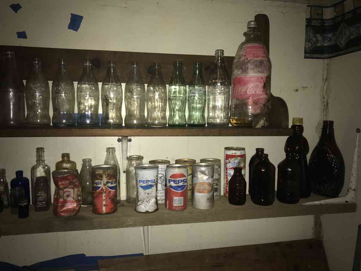 old soda bottles and beer bottles and others