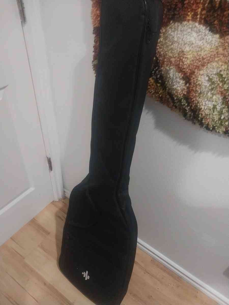 Bass guitar with amp cord and case