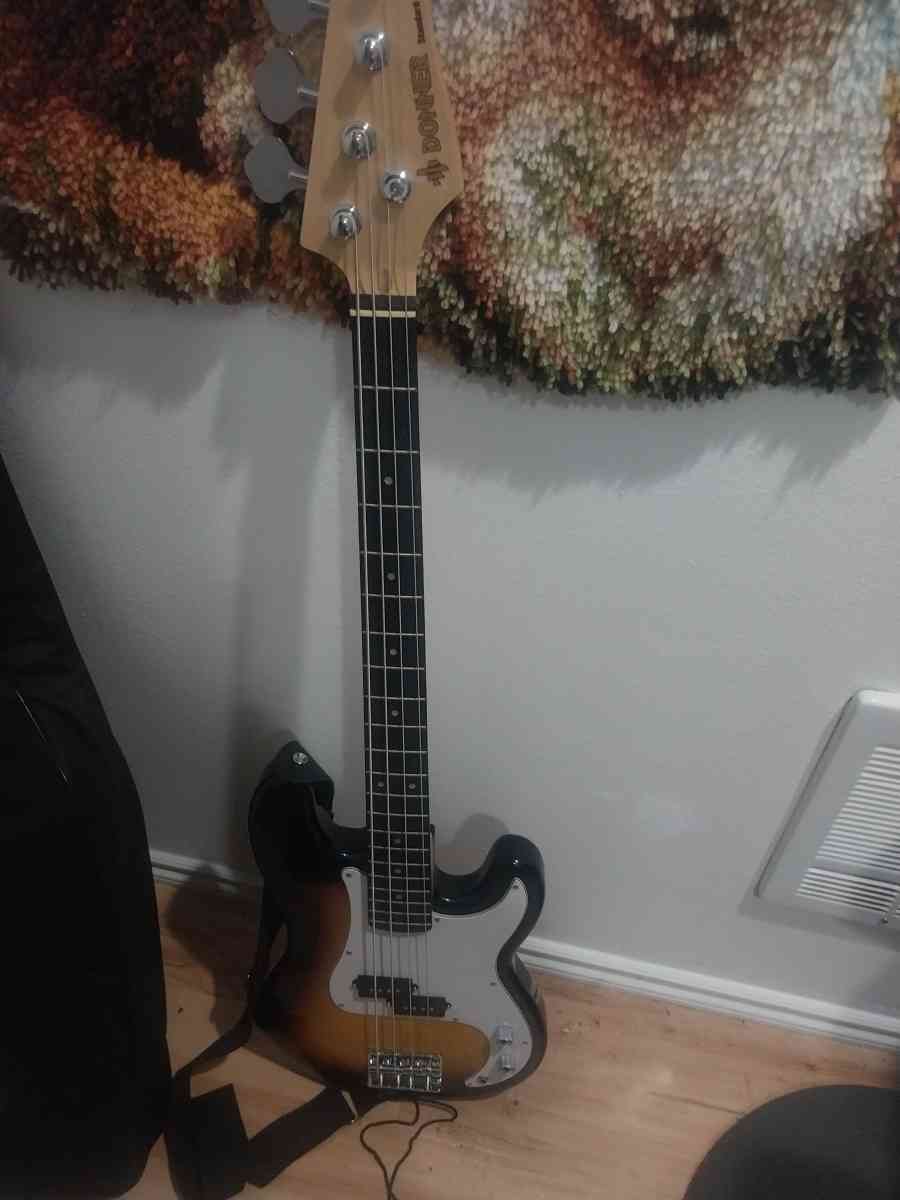 Bass guitar with amp cord and case