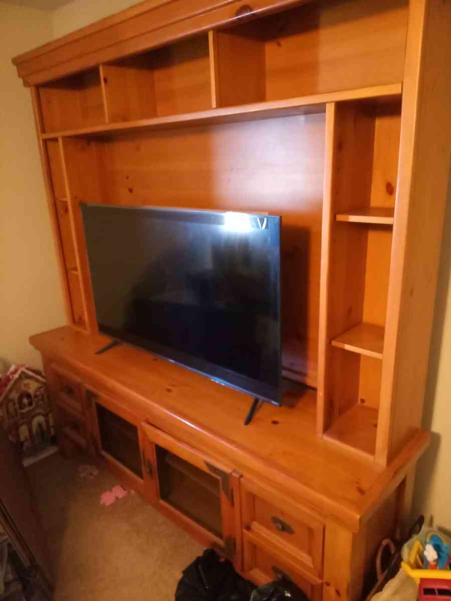 solid wood entertainment center with two end tables