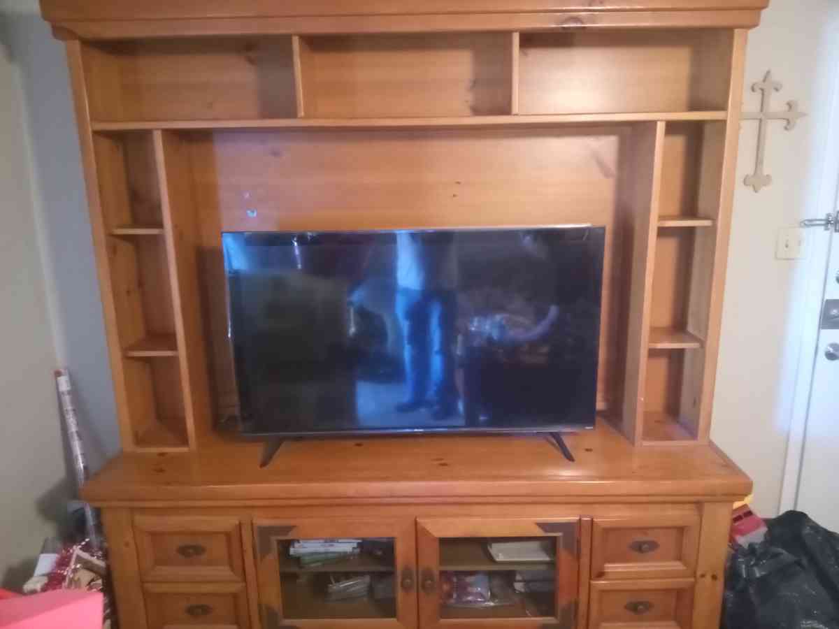solid wood entertainment center with two end tables