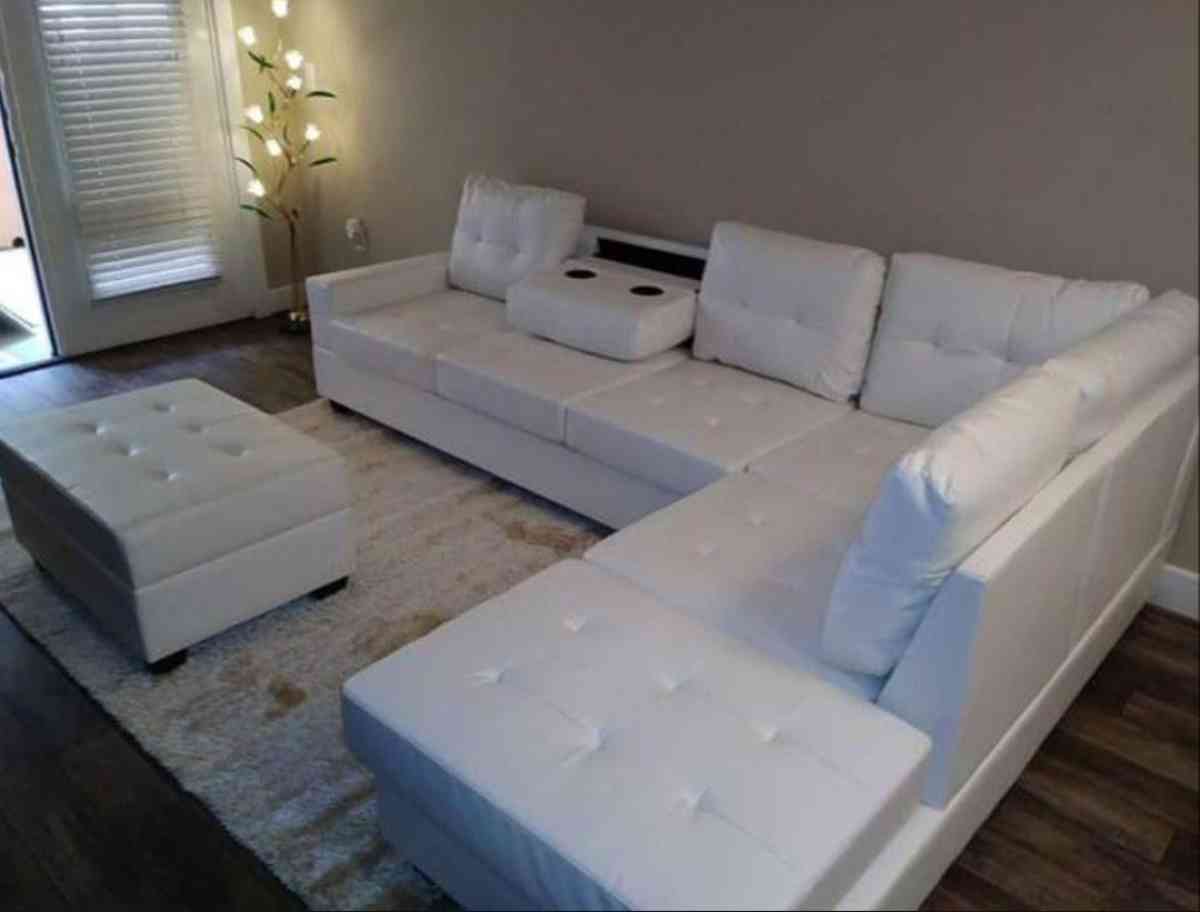 white Faux Leather Sectional with storage ottoman