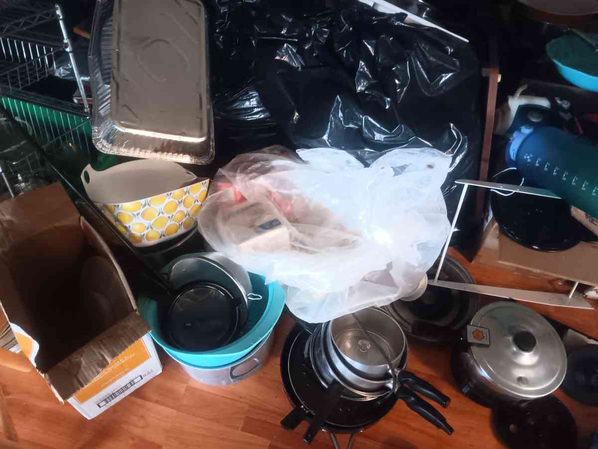 a large assortment of cookware bakeware and dishes