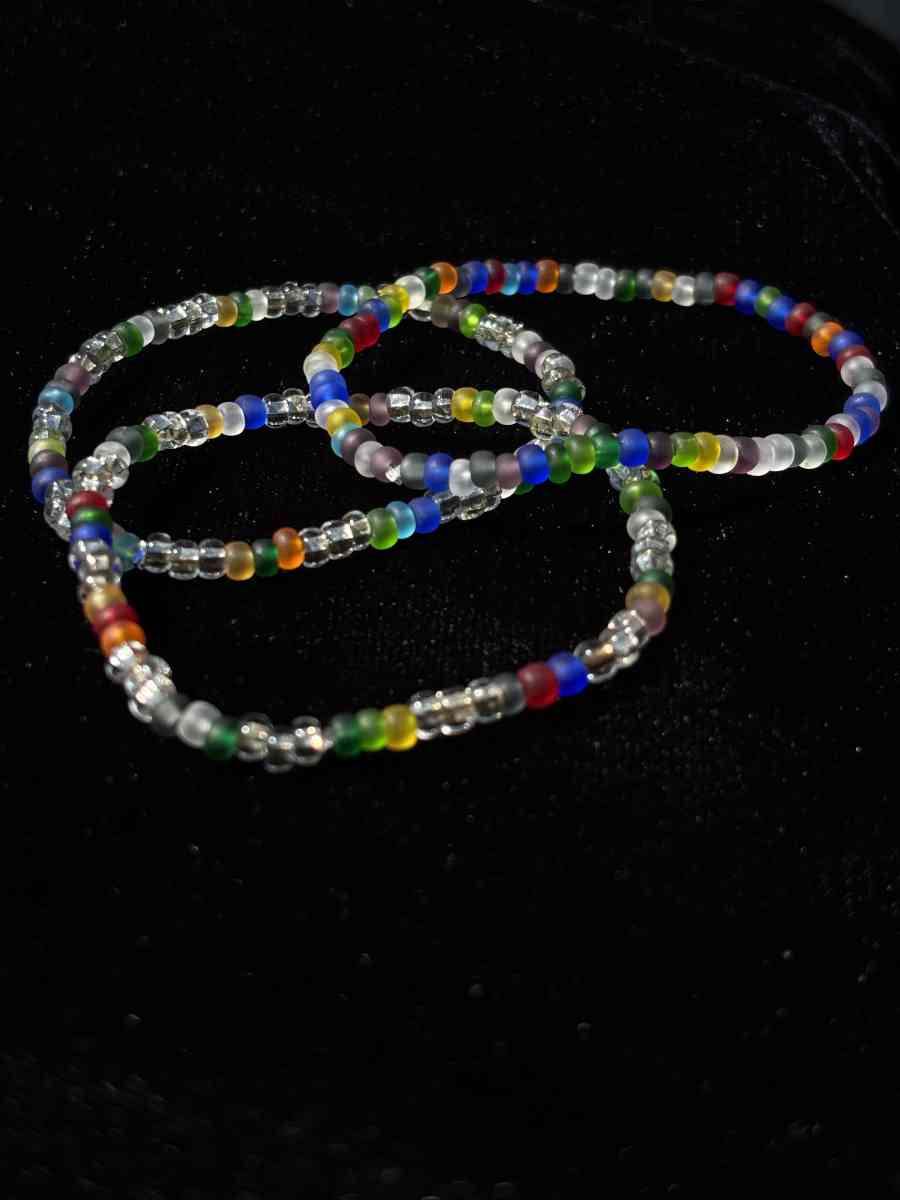 Set of 3 elastic rainbow and clear beaded bracelets