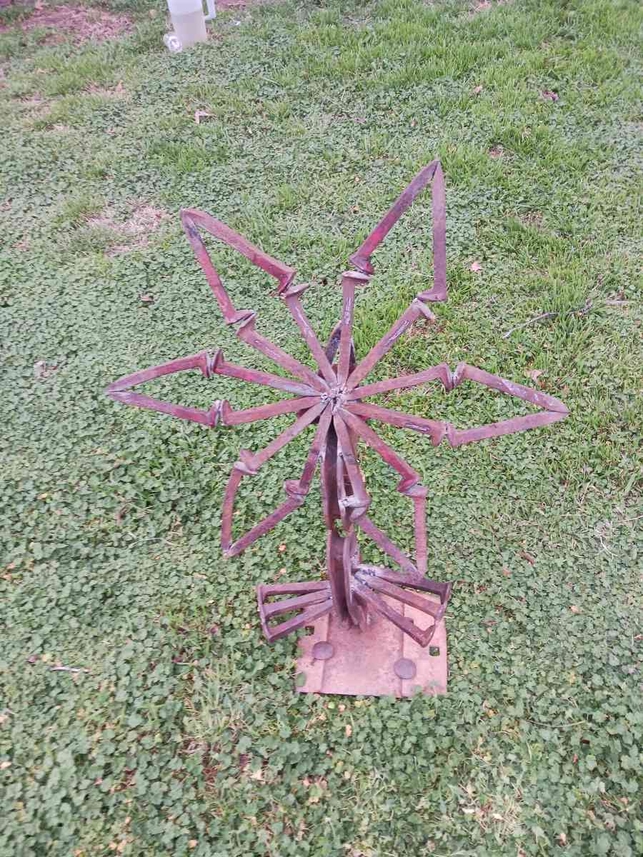 yard art flower made it out of train track spikes 65 for it