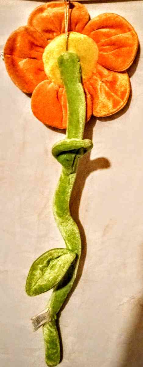Orange Flower with Yellow Smiley Face and Green Bendable Ste