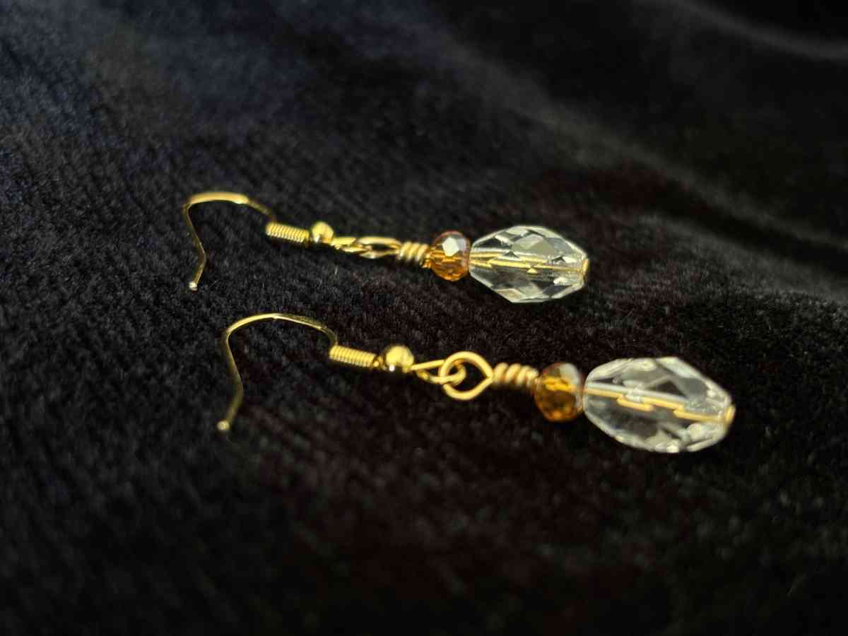 ambler and clear glass bead dangly earrings