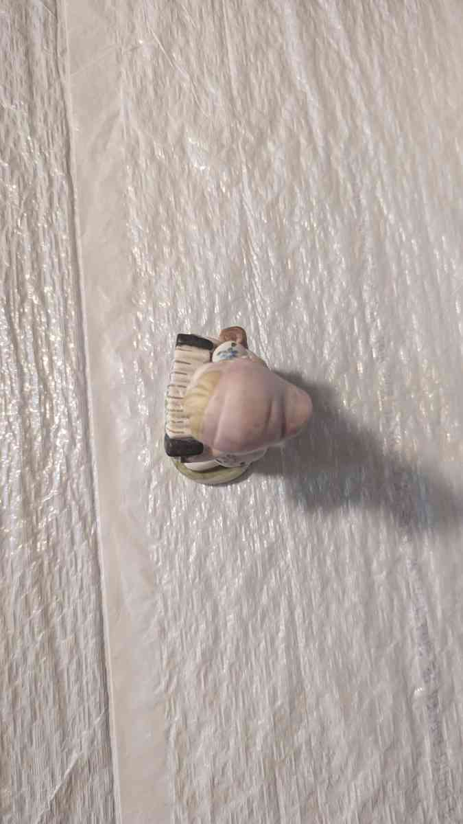 A Little Girl Playing an Accordion with a White Dress