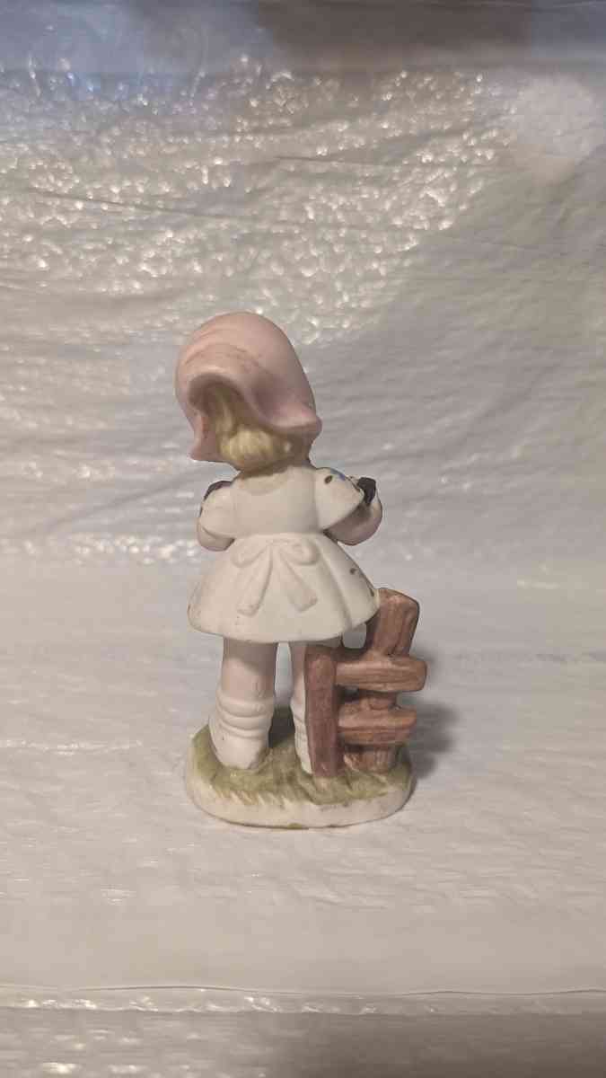 A Little Girl Playing an Accordion with a White Dress