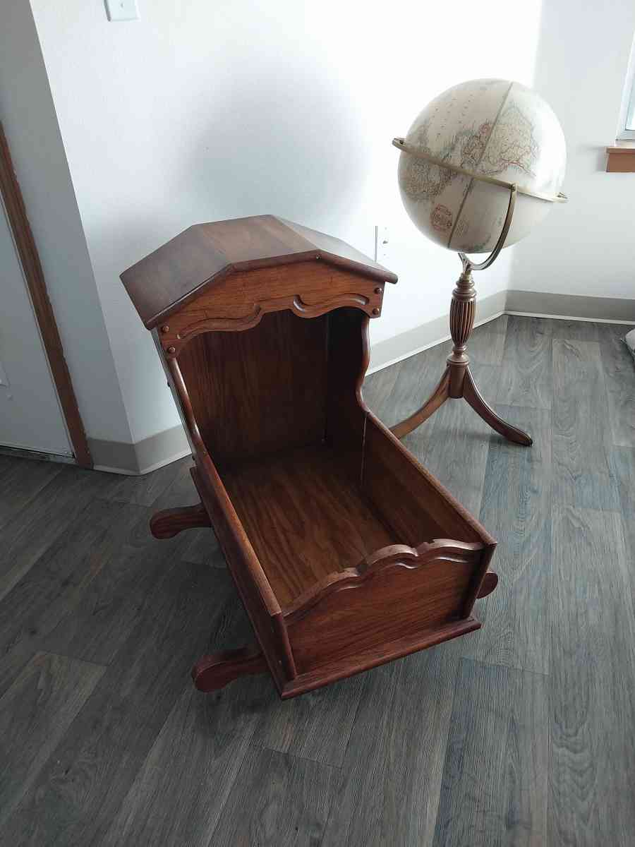 Hooded wooden rocking cradle