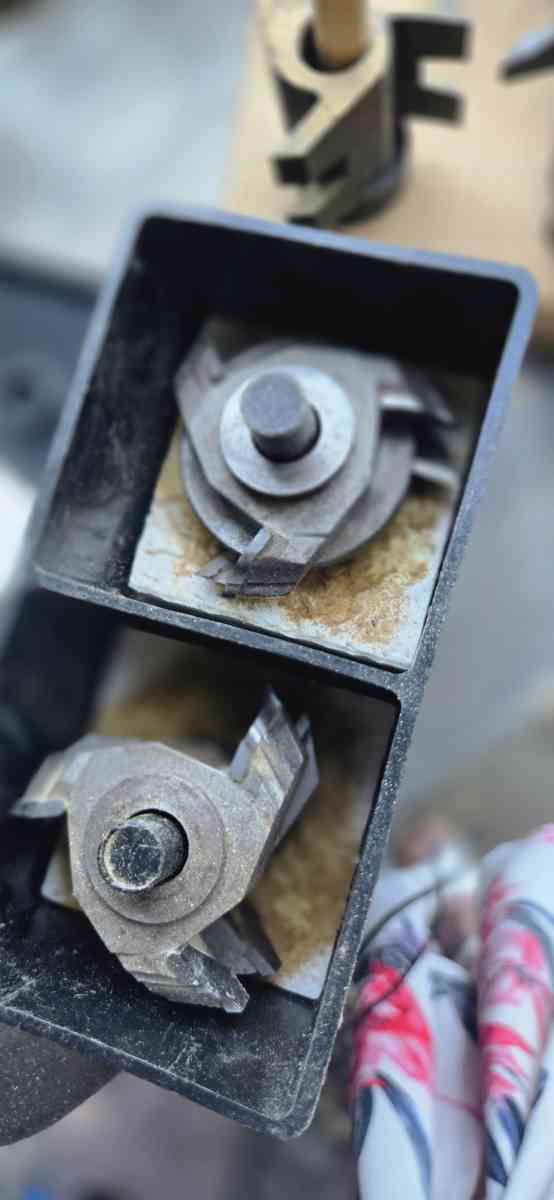 wood shaper with a bunch of bits