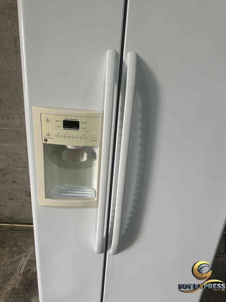 GE refrigerator side by side with ice and water dispenser