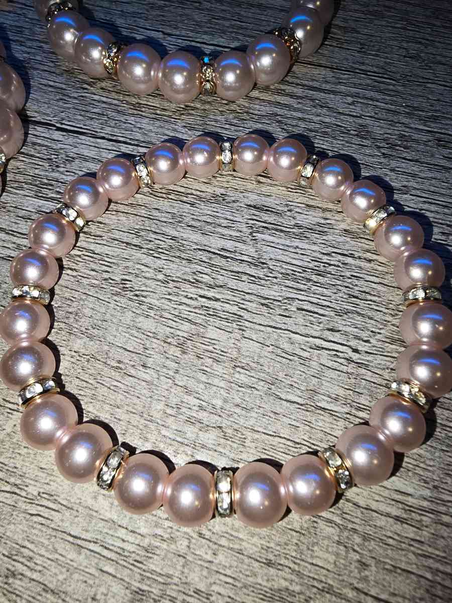 Brand New never worn set of 4 pink pearl Bracelets