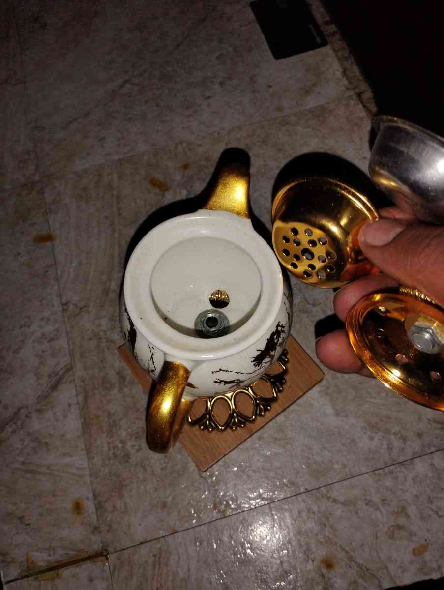 gold and white teacup