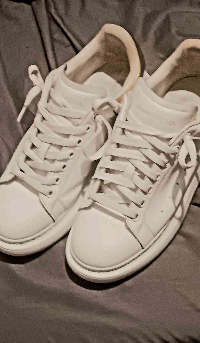 a pair of Alexander McQueen sneakers  size 9