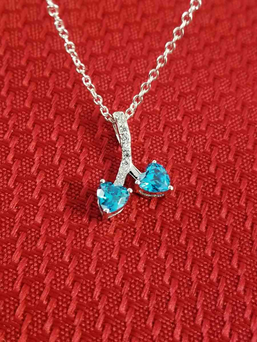 Sterling Silver blue Topaz and cz pendant