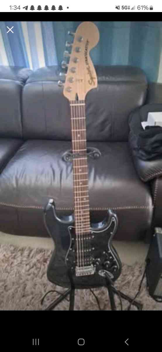 Black Electric guitar fender squier stratocaster