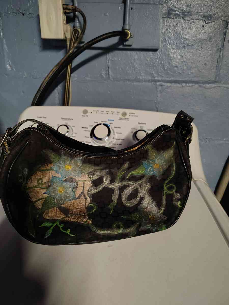 a black small purse Mine West