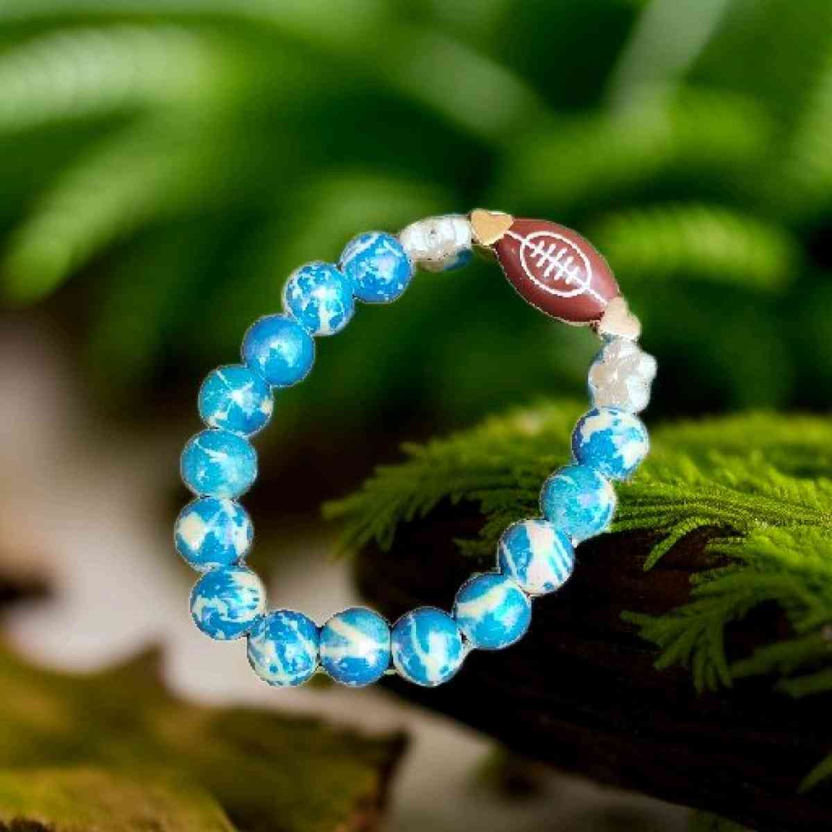 Football bracelet with blue accent beads