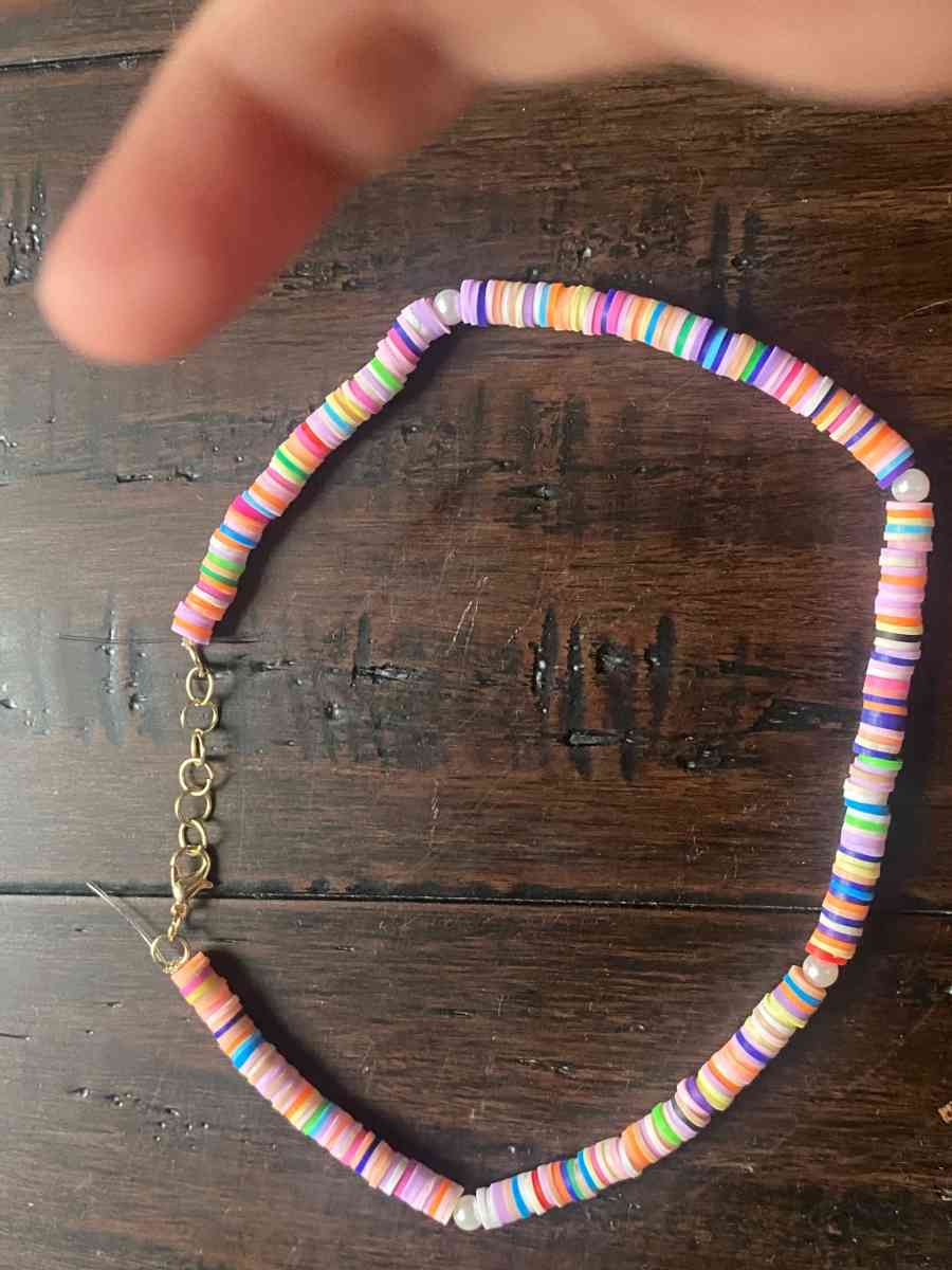 Beachy orangey necklace with pearls with different levels