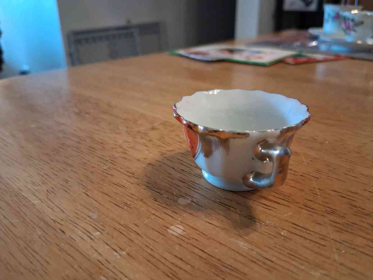 orange and pink flower design tiny teacup