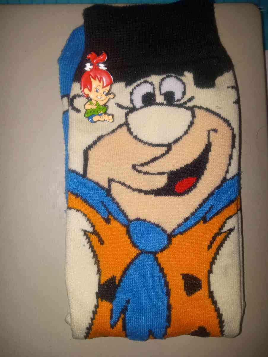 Fred Flintstone socks collectible with a pebbles pin