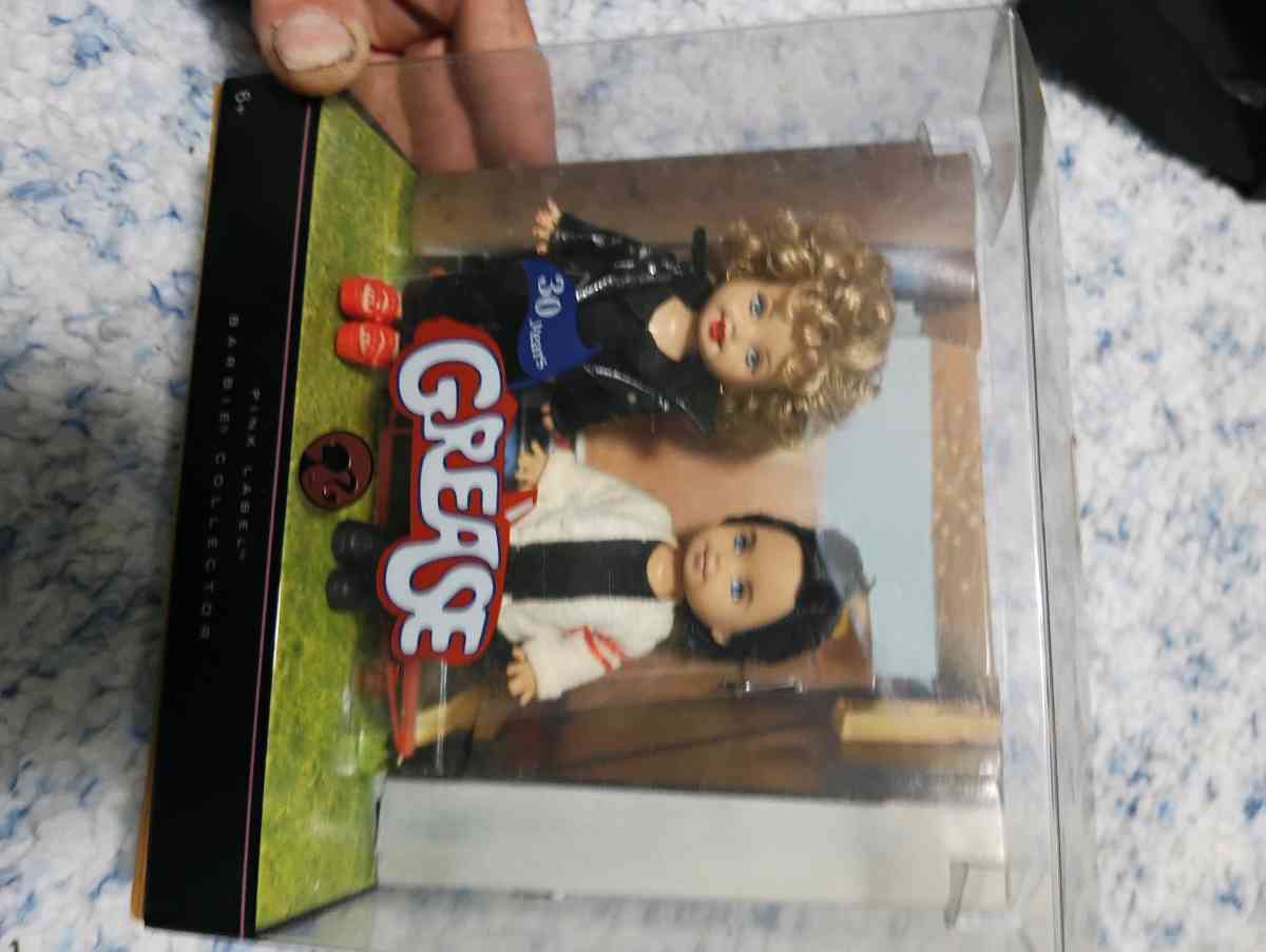 30 year of the movie Grease featuring Sandy and Danny dolls