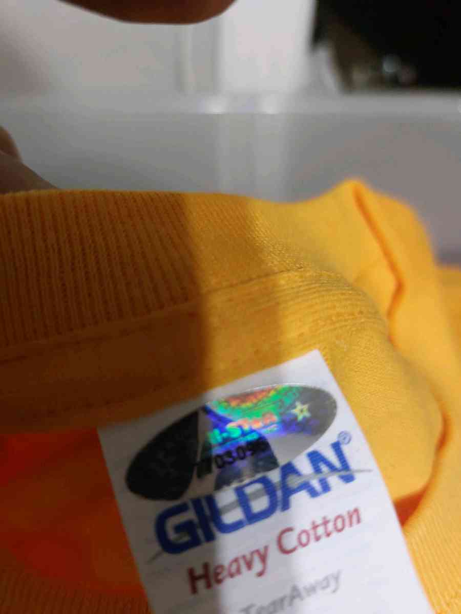 red and yellow autographed Tshirt