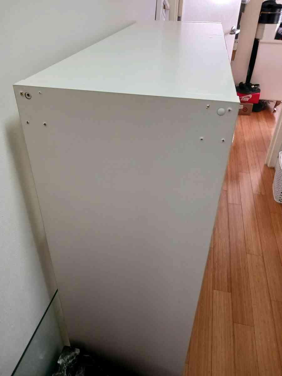 White Bookshelf on Wheels  9 Cube Storage Scratches  Holes - Bronx, New York - FleaMarketBay