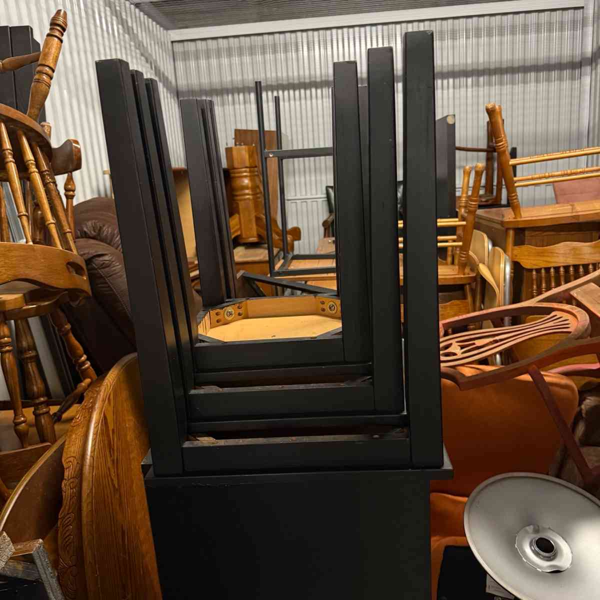 3 black tables slide under the other for easy storing used