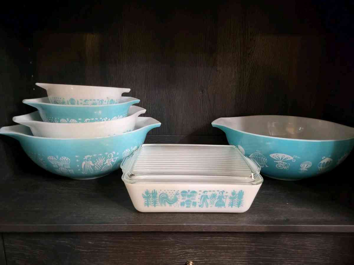 two sets of turquoise Pyrex vintage dishes