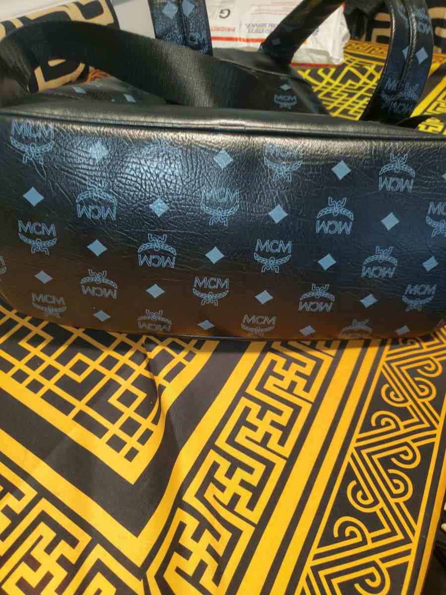 Mcm backpack black and gold