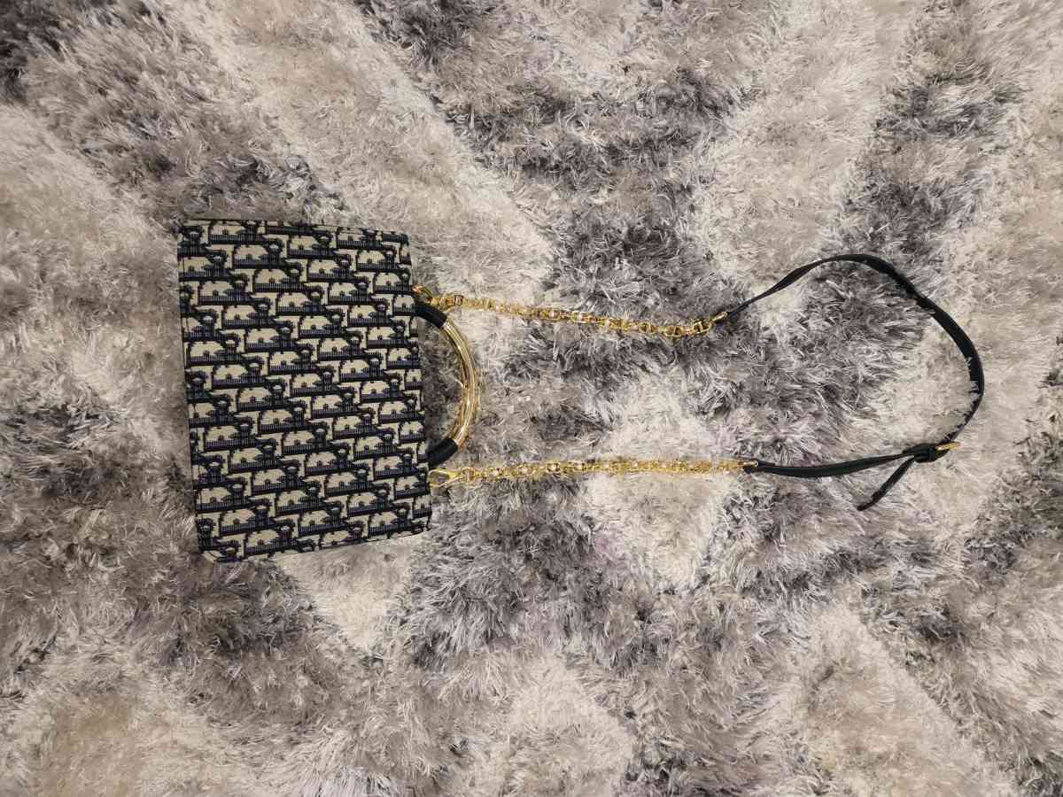 Luxury Monogram Handbag with Gold Accents and Pearl Lock Det