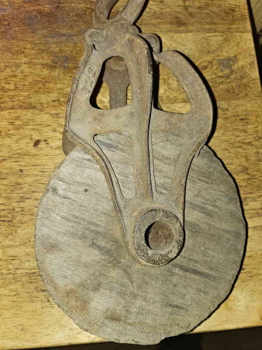 2 old wooden pulleys with metal frames 10 dollars for both