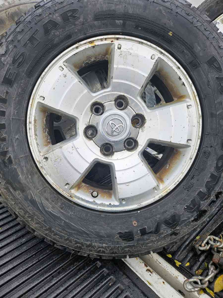 Five toyota tacoma wheels and tires - Elwood, Indiana - FleaMarketBay