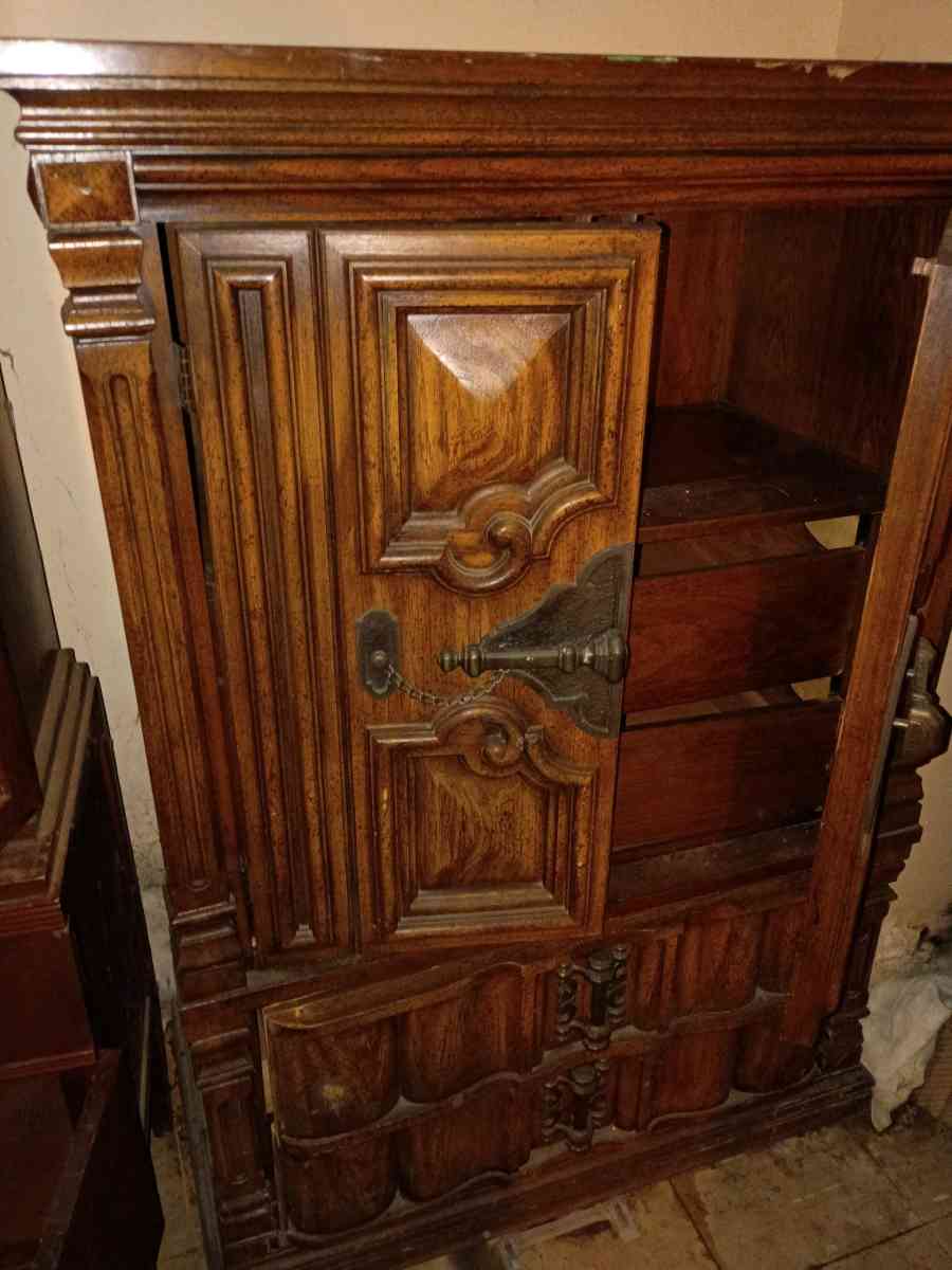 antique wooden cabinet with decorative designs