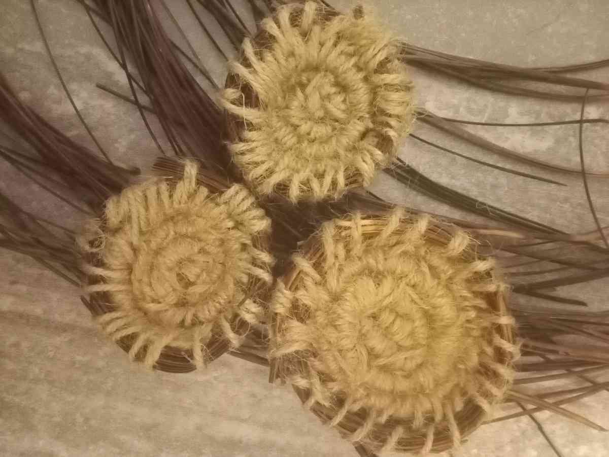 homemade jewelry order made out of pine needles and thread