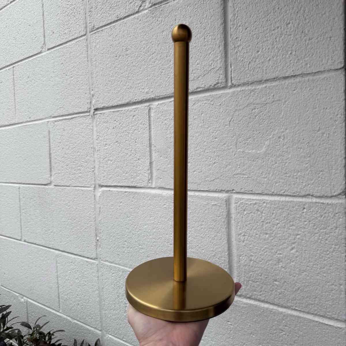 Threshold brass towel holder