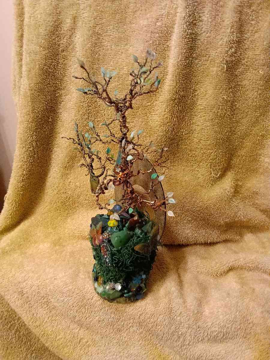 twisted copper tree with two owls