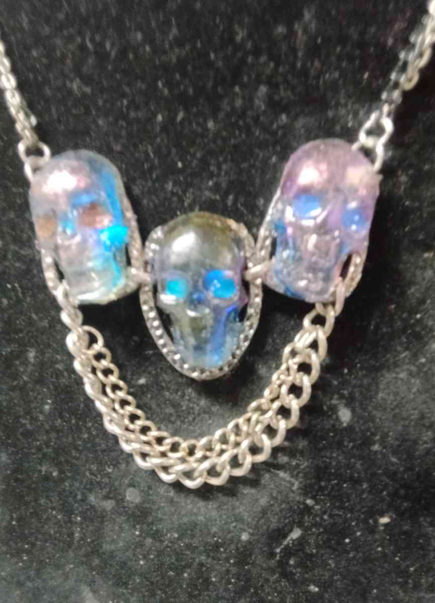 three skulls with multiple chains made with Uv resin