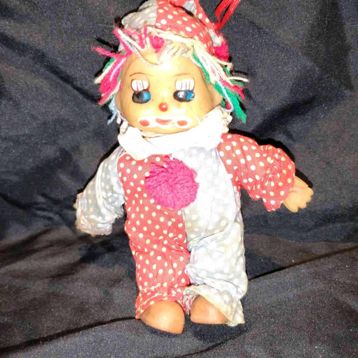 this is a vintage collectible clown doll cloth body vinyl he