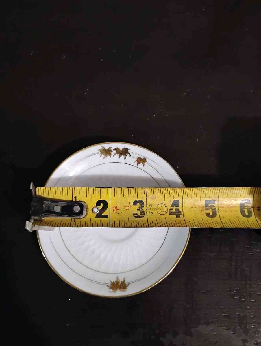 Set of 5 white with gold trim teacup saucers