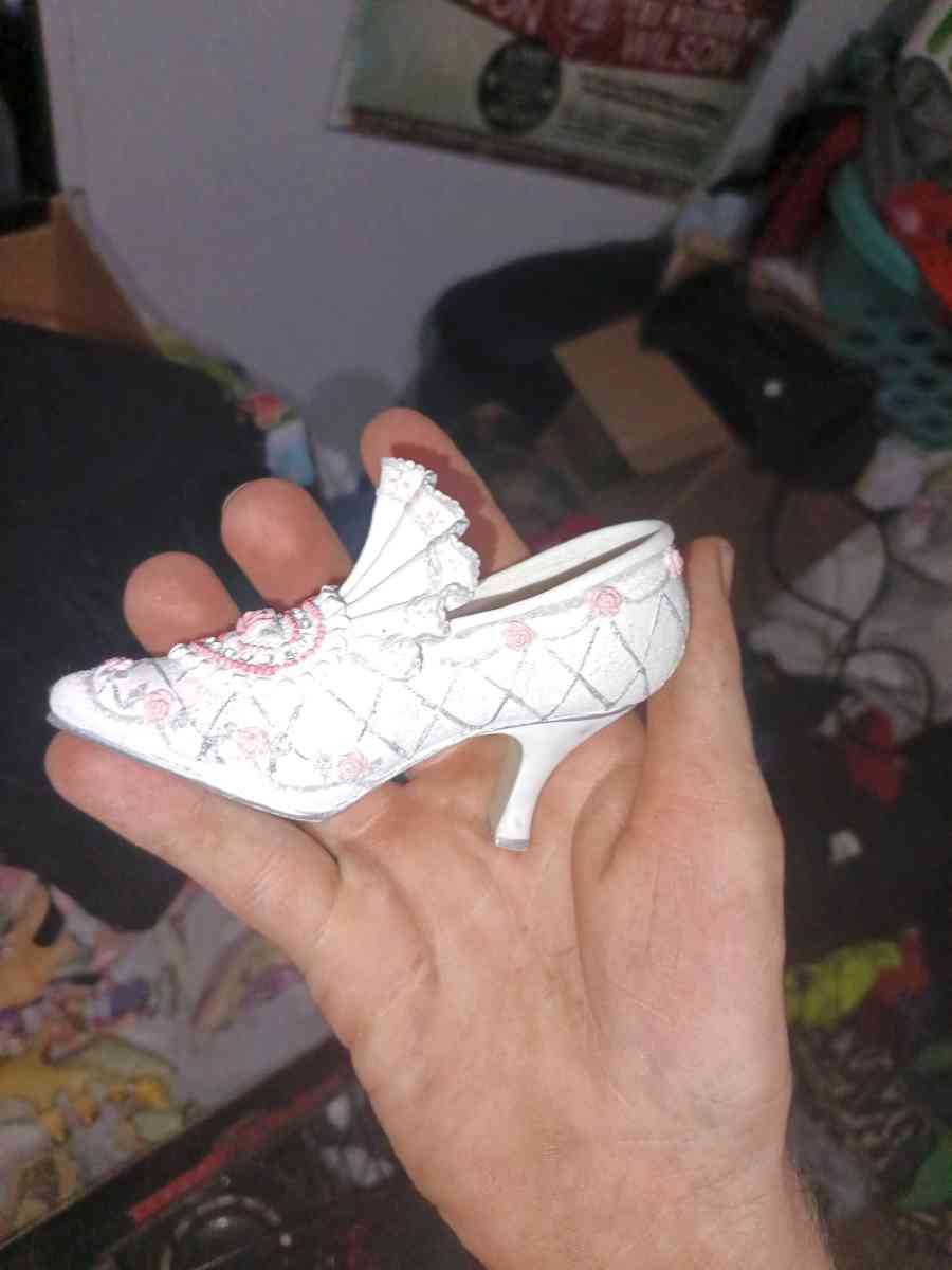 The product is a 35 ceramic Victorian floral shoe collectibl