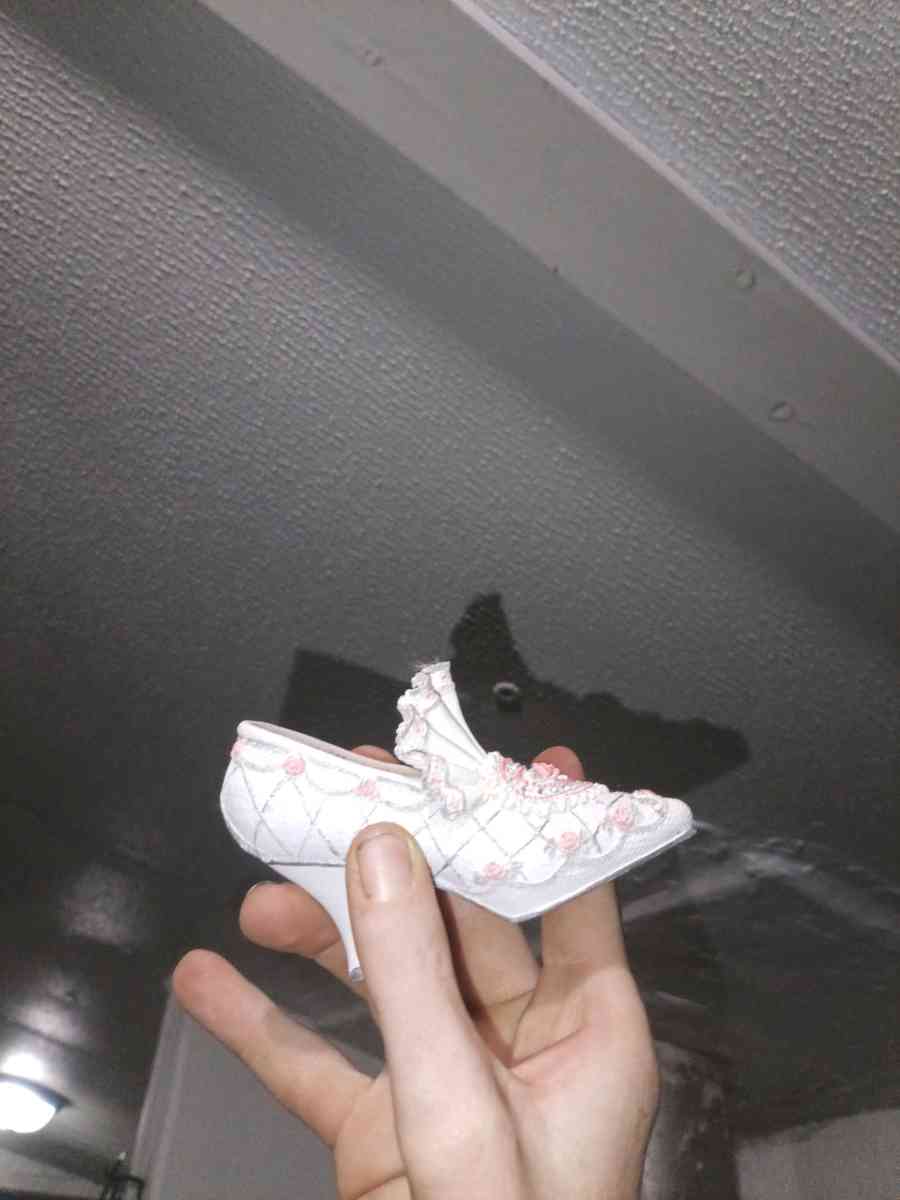 The product is a 35 ceramic Victorian floral shoe collectibl