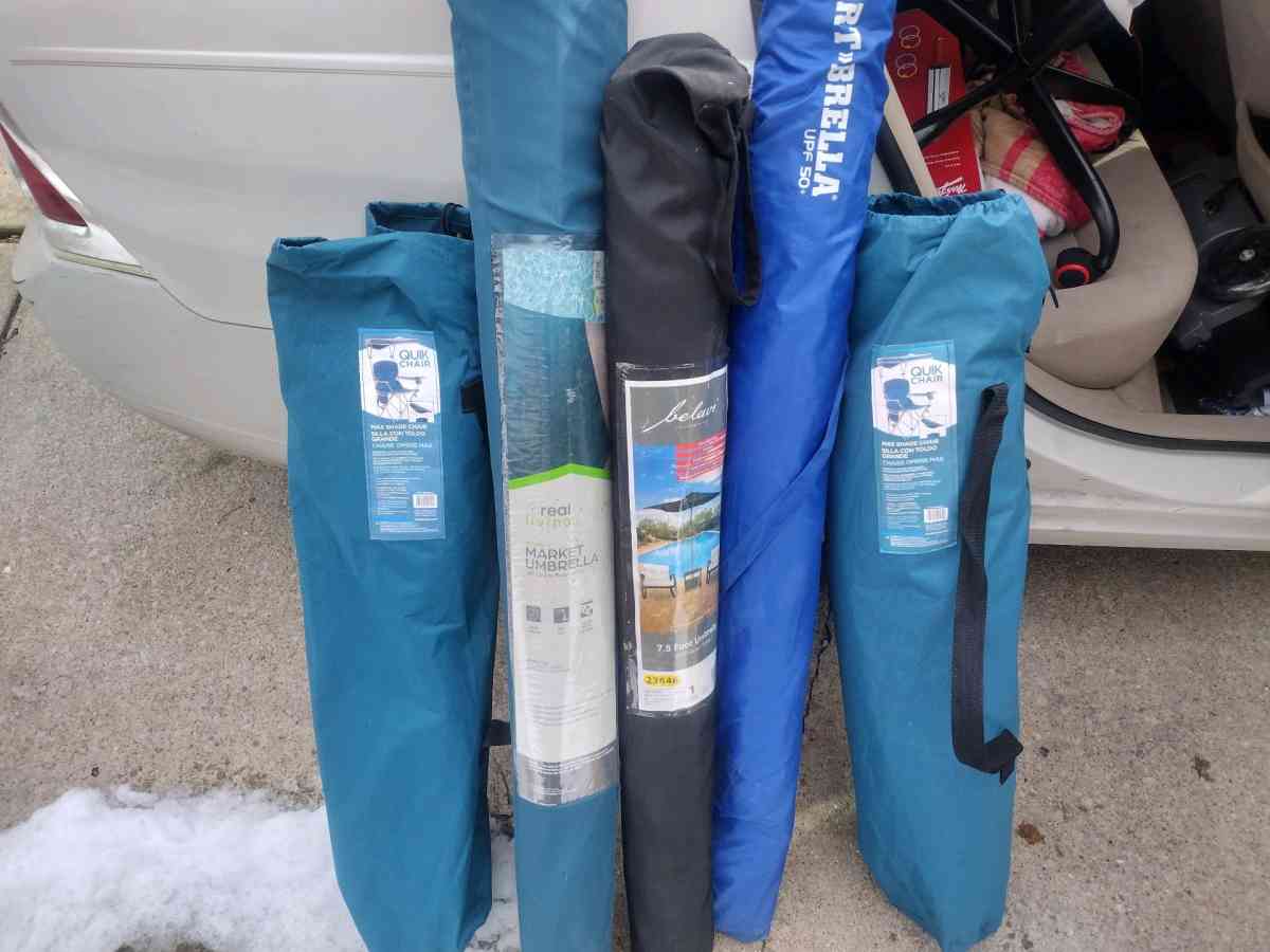 two chairs with canopies over the top three umbrellas 50 eac